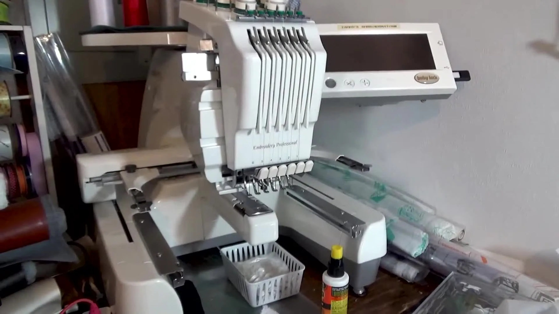 A wide view of a Baby Lock Enterprise multi-needle embroidery machine, highlighting the table and cylinder arm areas that can cause vinyl drag.