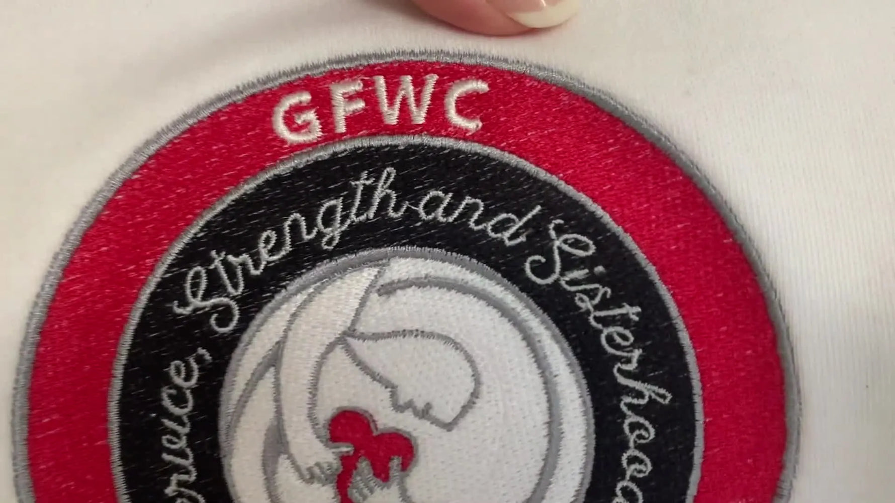 A macro close-up shows a failed red fill stitched with 60wt thread where the white fabric visibly peeks through, making the coverage look weak.