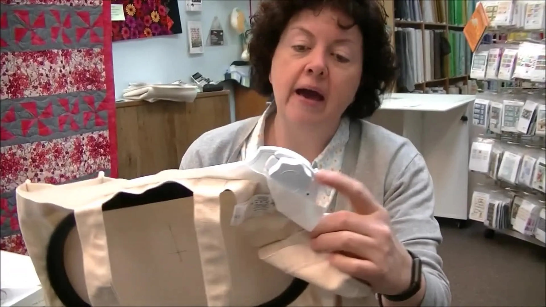 Pam showing the back of the large freearm hoop with the ratchet mechanism.