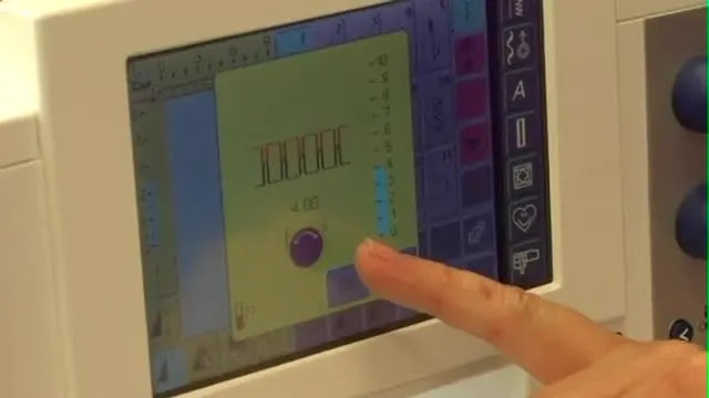 A close-up of the Bernina LCD screen as the upper thread tension is lowered for specialty thread control.