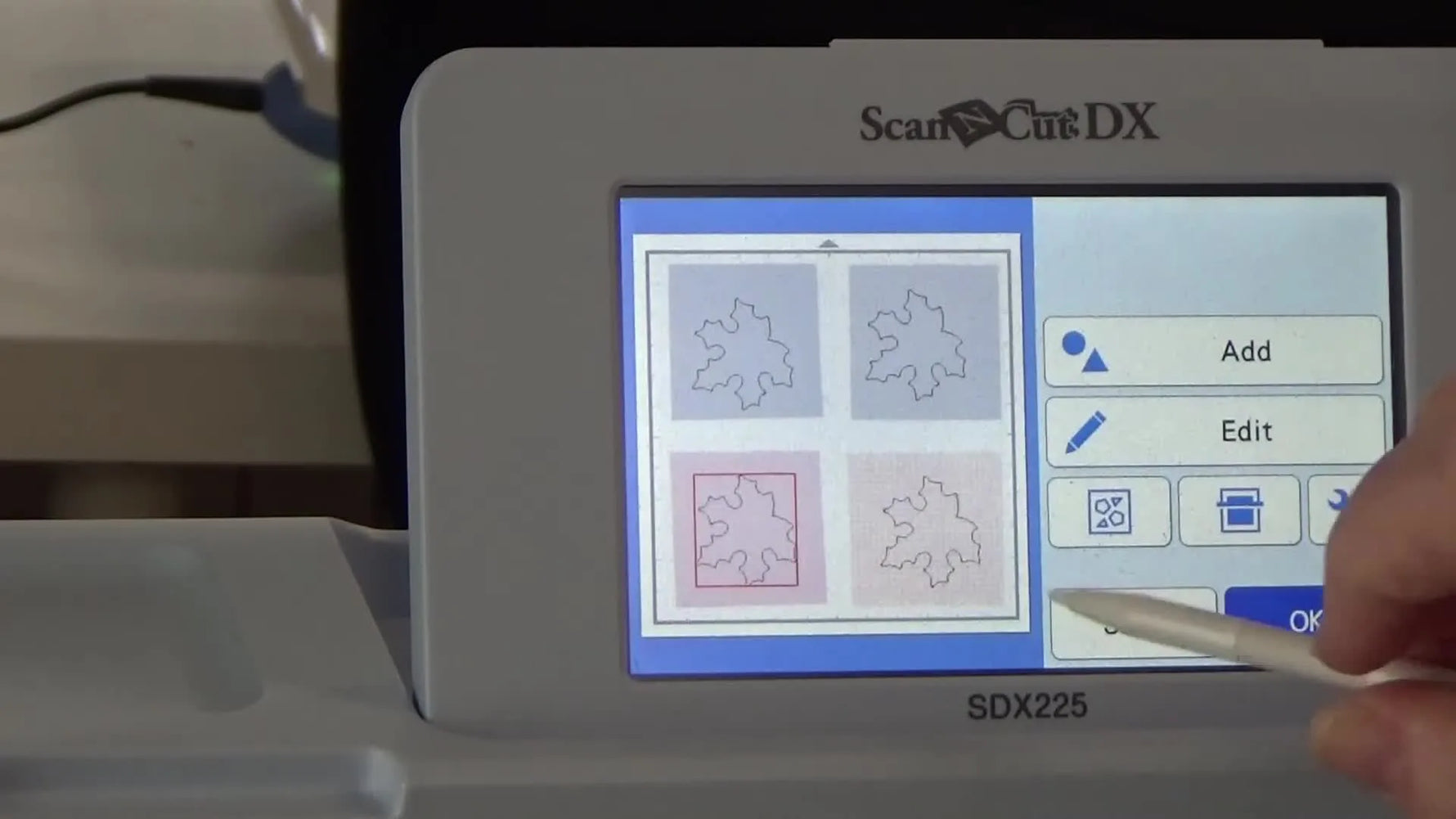 The Brother ScanNCut SDX225 screen shows cut lines precisely aligned over the scanned fabric on the mat.