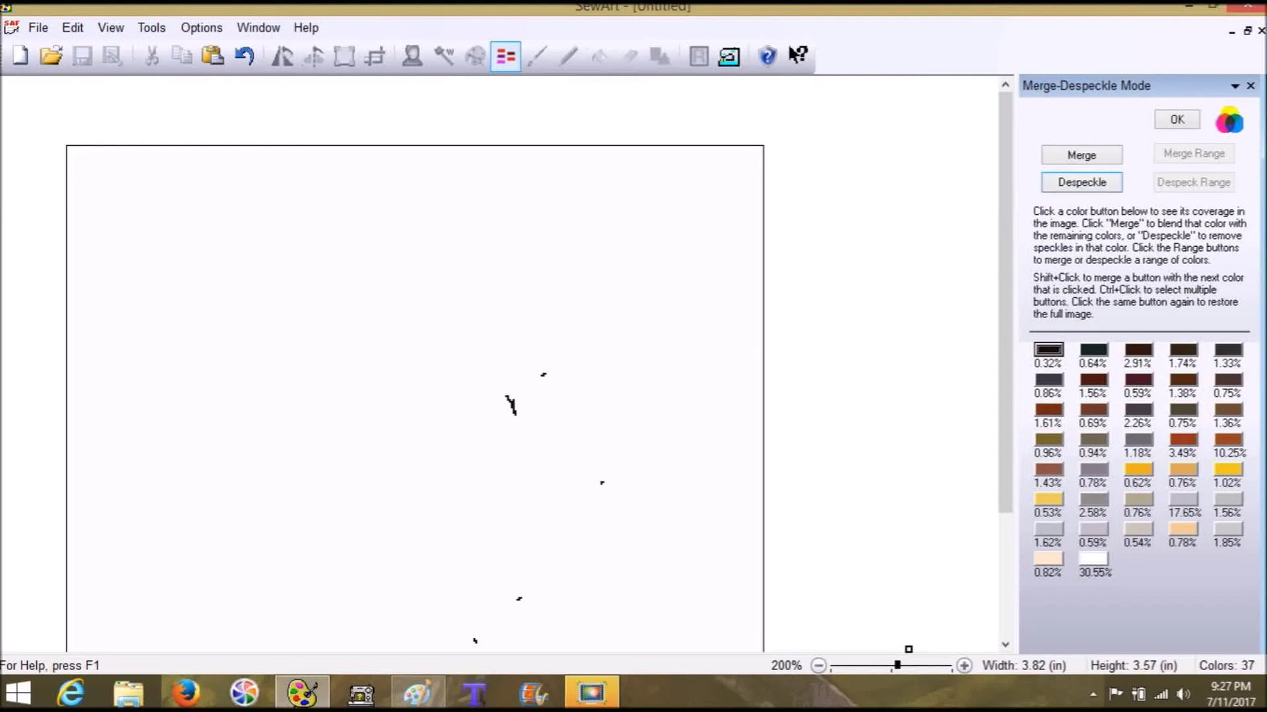 A close-up of SewArt’s Merge Colors preview where the cursor click-drags to erase tiny stray pixels that would otherwise become messy stitches.