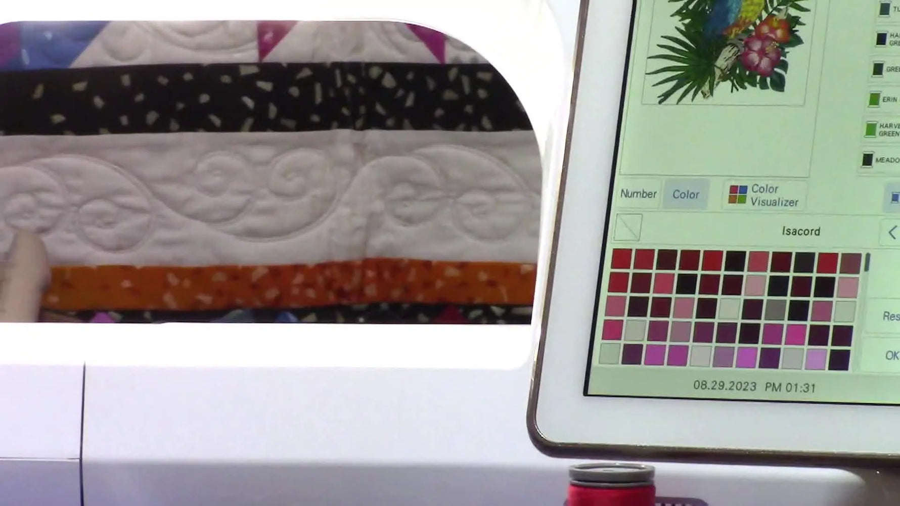 A Baby Lock multi-needle embroidery machine screen shows the numeric keypad overlay used to enter an exact thread color number.
