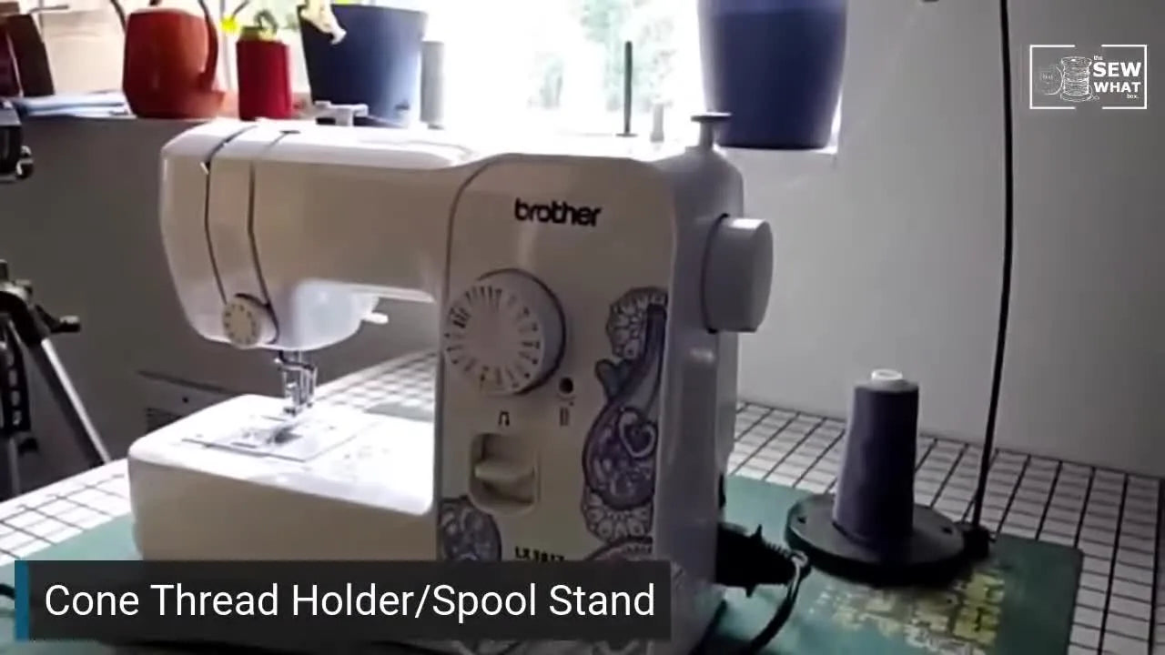 Full view of the sewing machine and cone thread holder with thread properly set up.