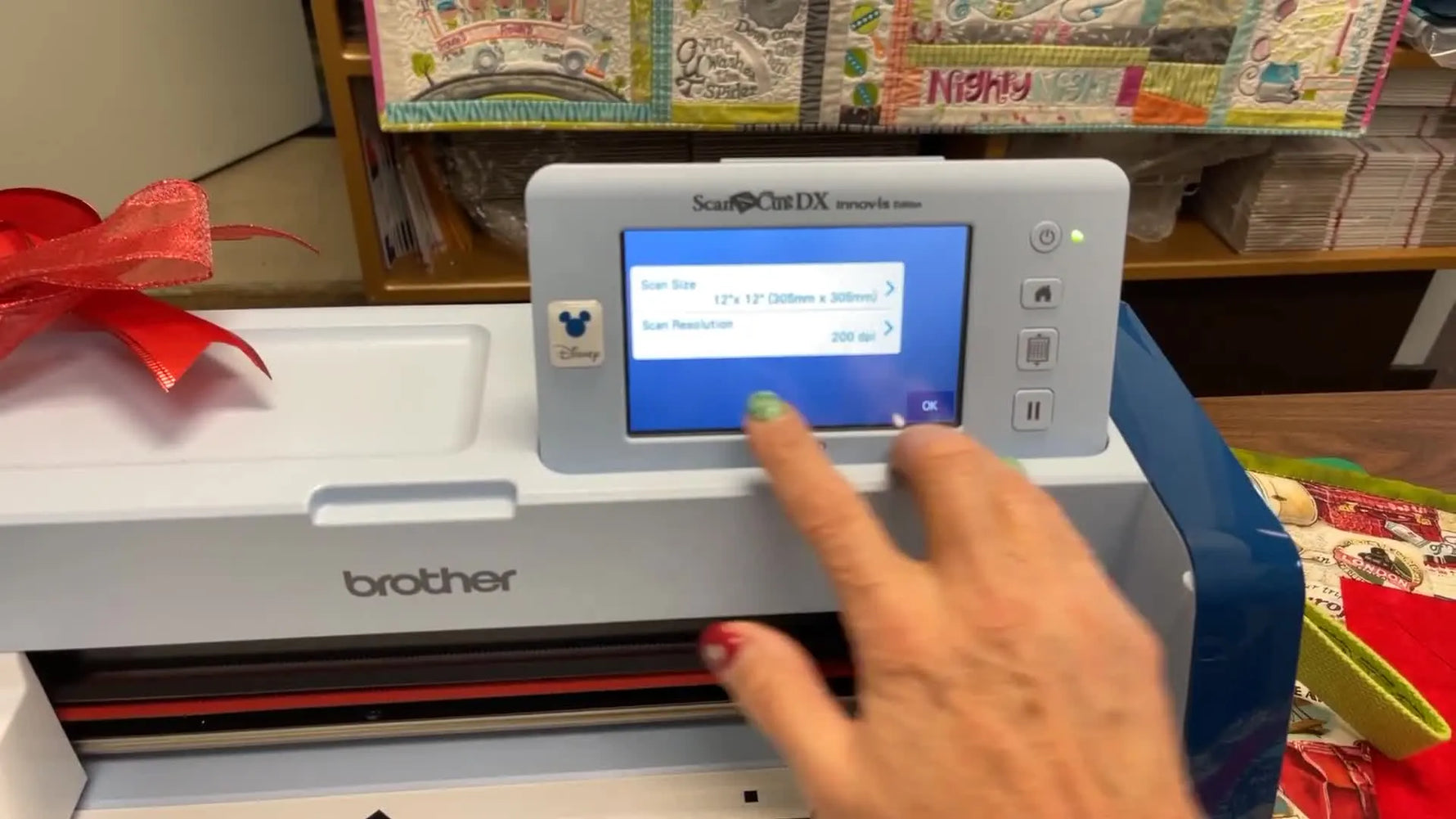 A close-up of the Brother ScanNCut settings screen with scan resolution set to 200 DPI for clean line-art conversion.