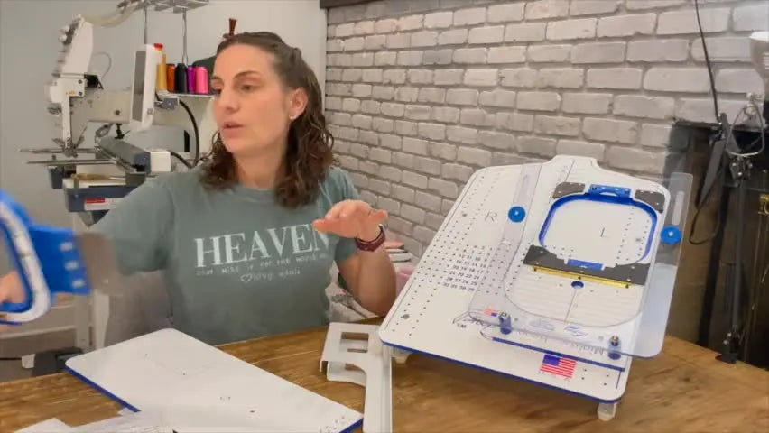 A wide shot of the Hoop Master station with the 8.41" x 9.18" Mighty Hoop installed in the fixture, showing a fully assembled, ready-to-hoop setup.