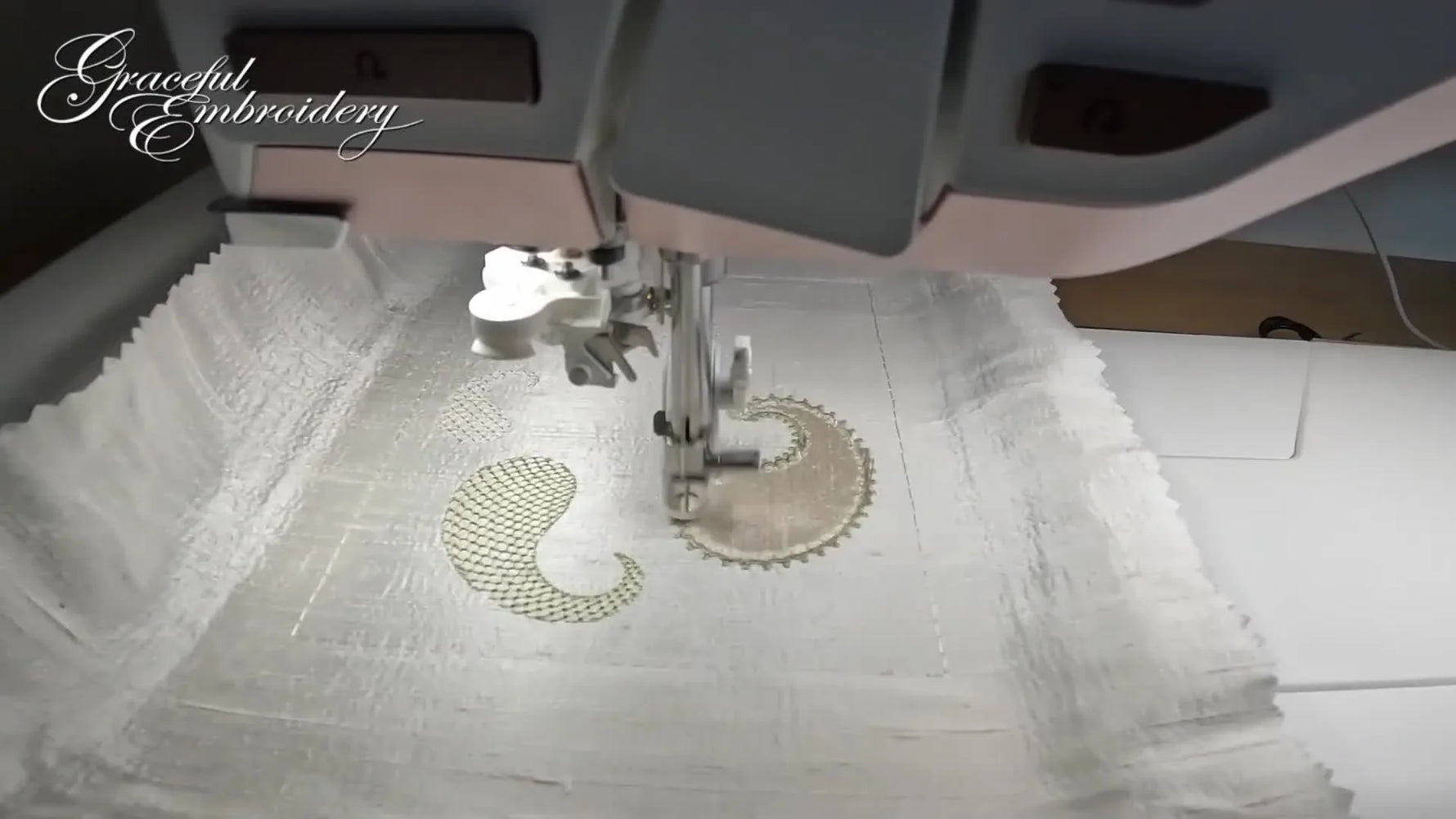 A close-up of satin stitching wrapping a paisley appliqué edge on ivory silk, showing the clean finish you’re aiming for.