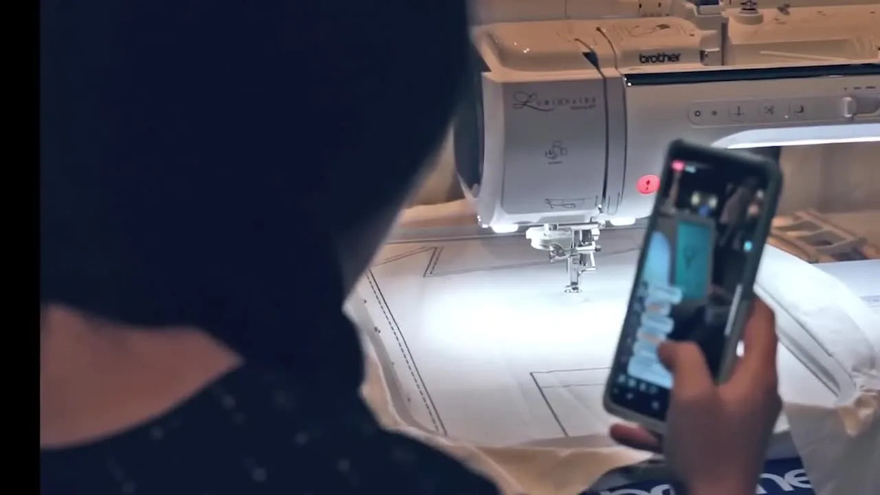 The Brother Luminaire Innov-is XP1 projects the embroidery design directly onto the hooped shirt so you can place the key element precisely before stitching.