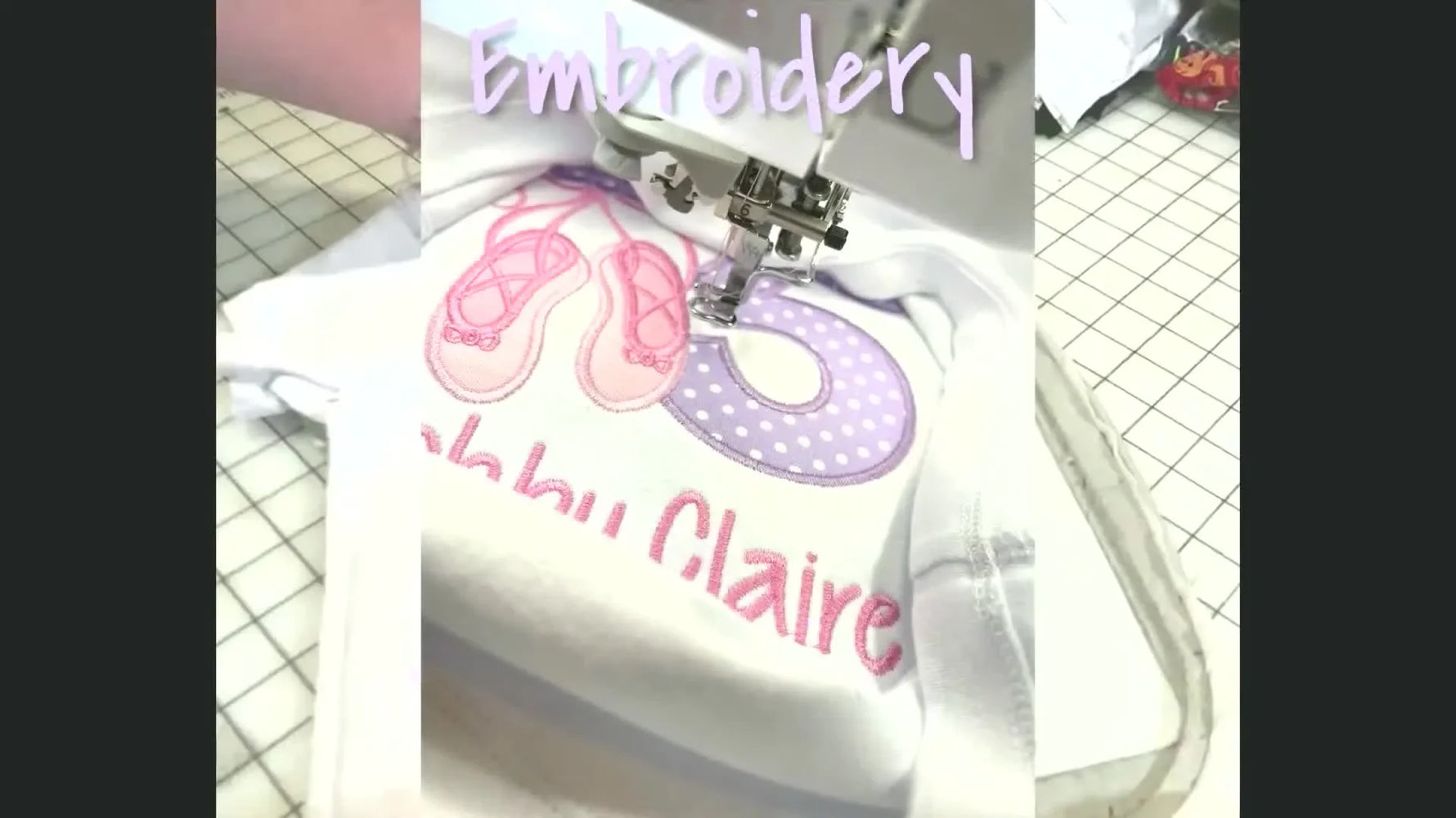 Close-up of an embroidery machine stitching a ballet slipper design onto a onesie, showcasing active machine embroidery.