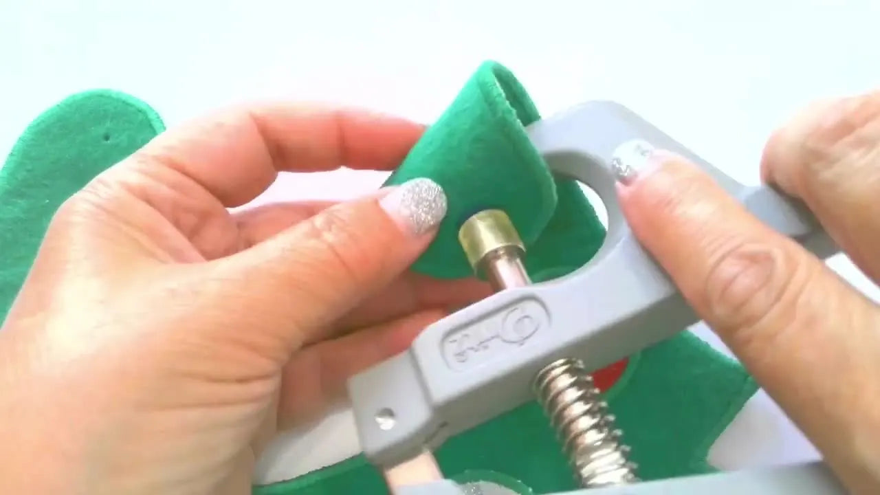 The finished lined Christmas Tree baby bib is displayed flat, showing clean edges, appliqué ornaments, and a professional no-raw-seams finish.