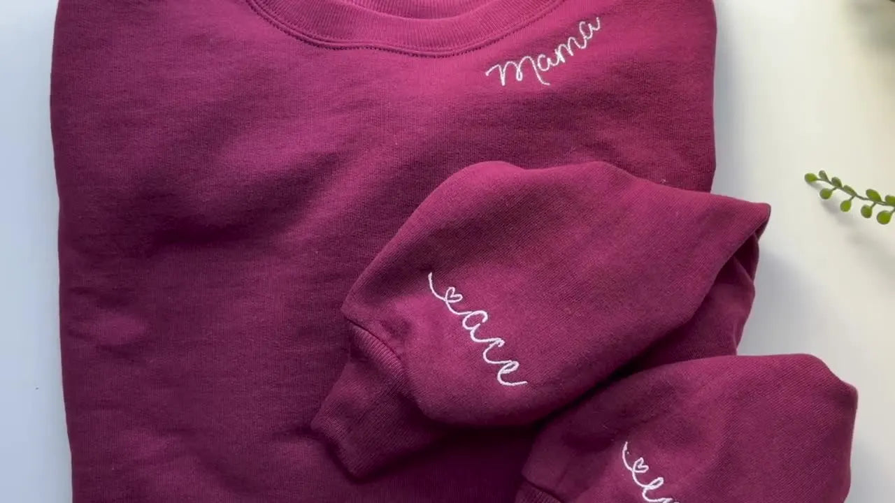 Finished maroon sweatshirts with coordinated sleeve names and a clean, professional prove-it result shot.