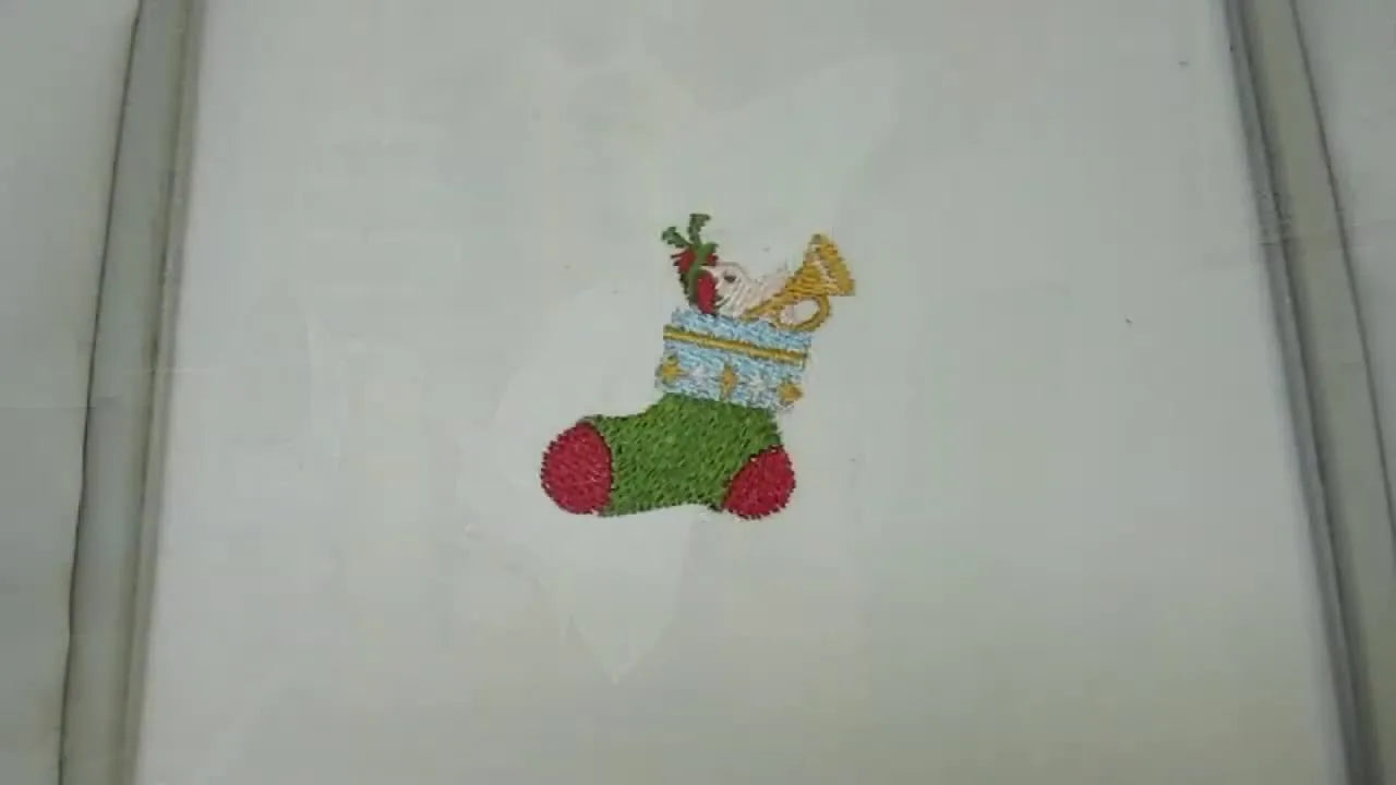 A close-up of the finished Brother SE-400 Christmas Stocking Design #31 stitched on white fabric, ready for final cleanup and presentation.