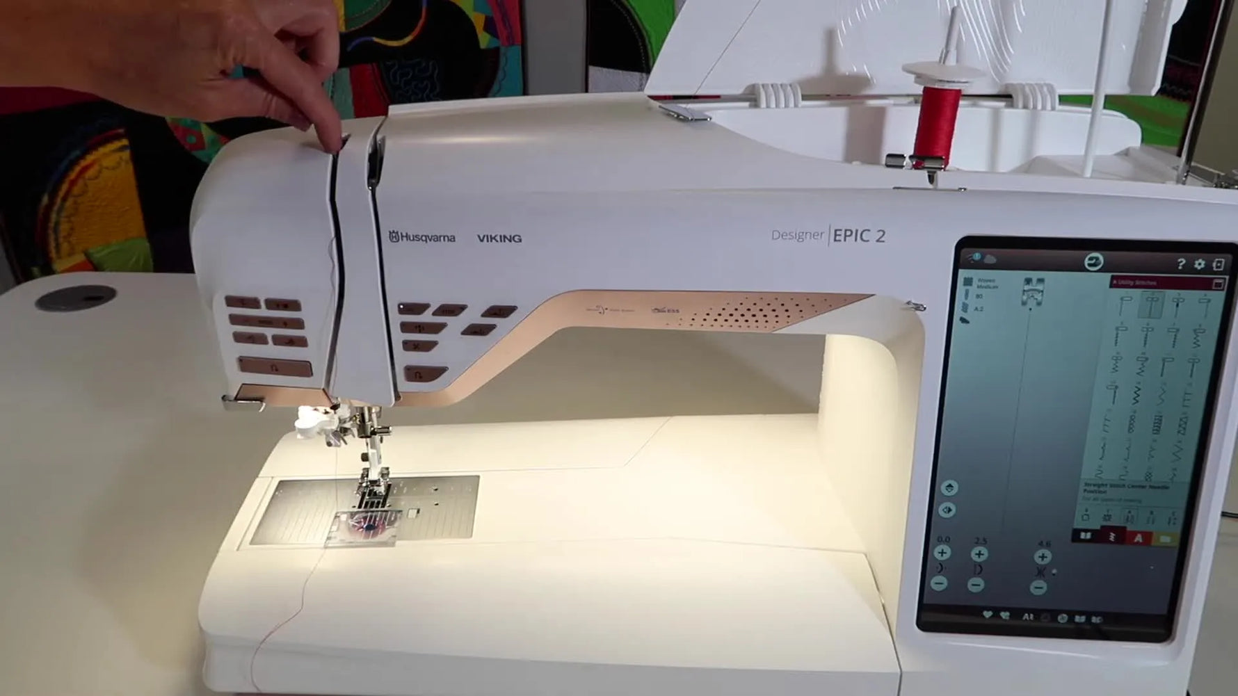 Close-up of the EPIC 2 needle area showing the final thread guide and presser foot just before using the automatic needle threader.