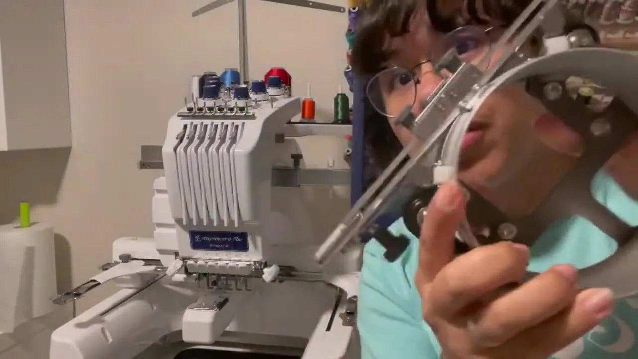 Woman holding a cap driver attachment, showing it to the camera.