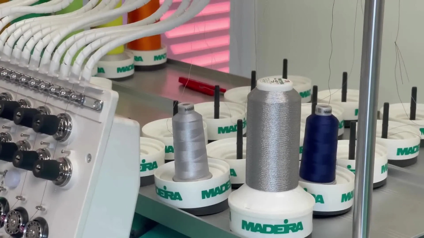 A Tajima machine stitches the final embossed design through a floated sweatshirt layered over pre-tacked 3mm foam on hooped stabilizer.