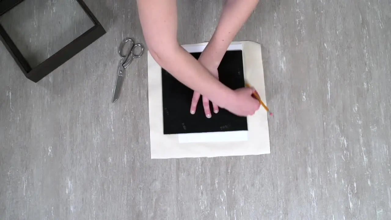 A finished 3D embroidered butterfly mounted on canvas and framed inside a shadow box for dimensional wall art.