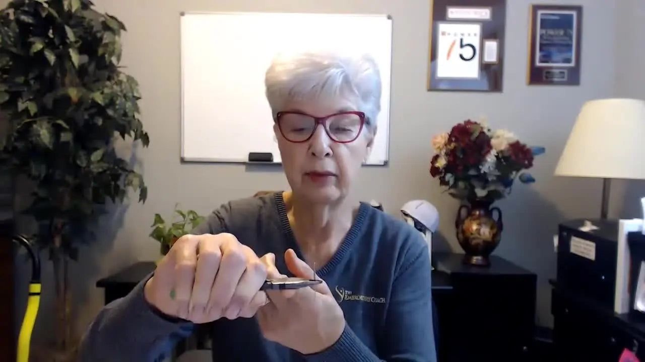A close-up shows the stabilizing finger placement under the pliers grip that keeps the needle straight during insertion.