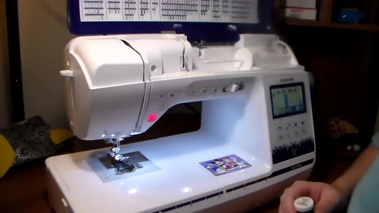 A wide view of the Brother NQ3500D with the top lid open, ready for threading and bobbin setup.