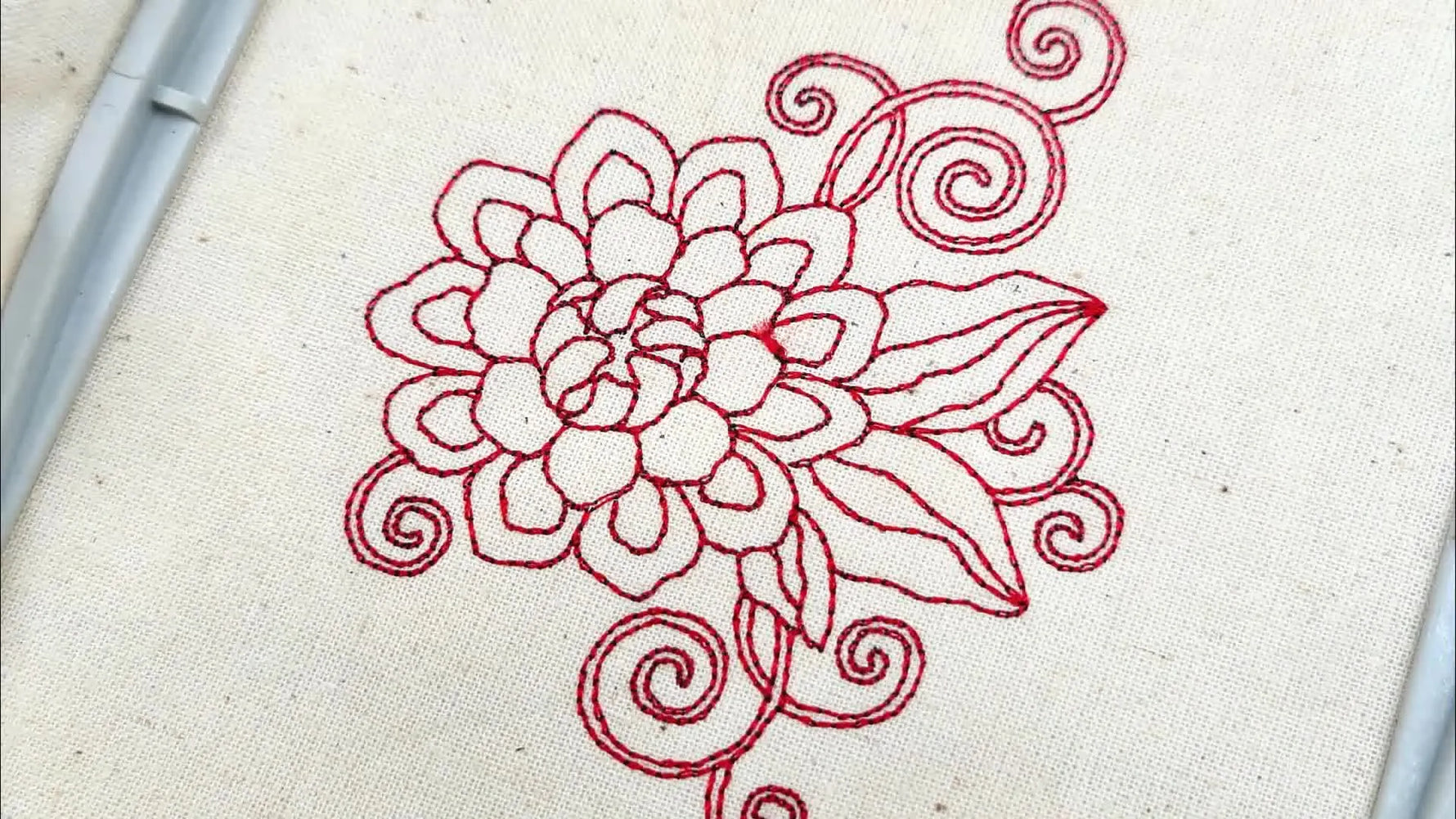 Finished Redwork floral embroidery design on fabric.