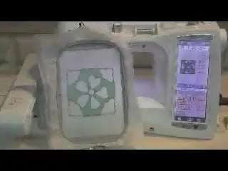 Close-up of the hooped appliqué after trimming, showing clean cut-out petal voids that will be filled with lace stitching.