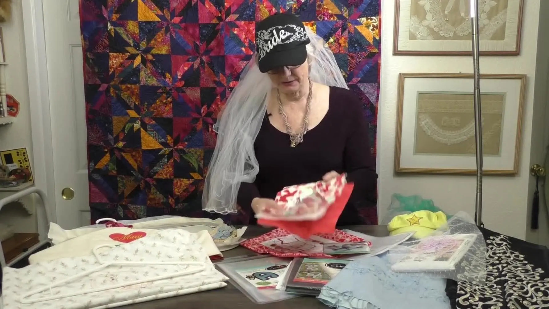 A close-up of a finished red-and-white fabric banner reading “LOVE” with crisp 3D puff foam letters.