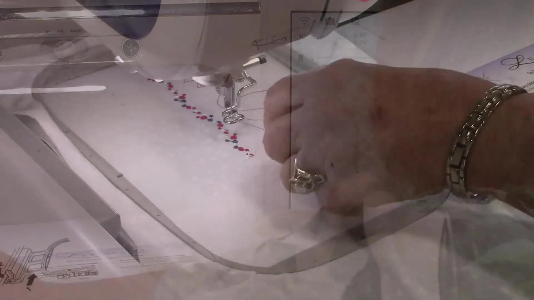 Close-up of stitched reference marks on fabric, showing the alignment anchors that make continuous borders repeat cleanly.