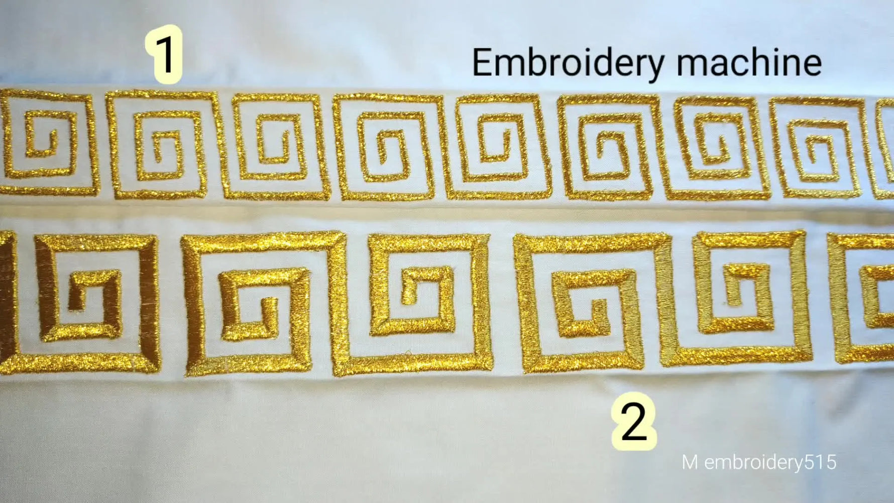 A white fabric displays two rows of completed gold embroidered spiral square border designs.