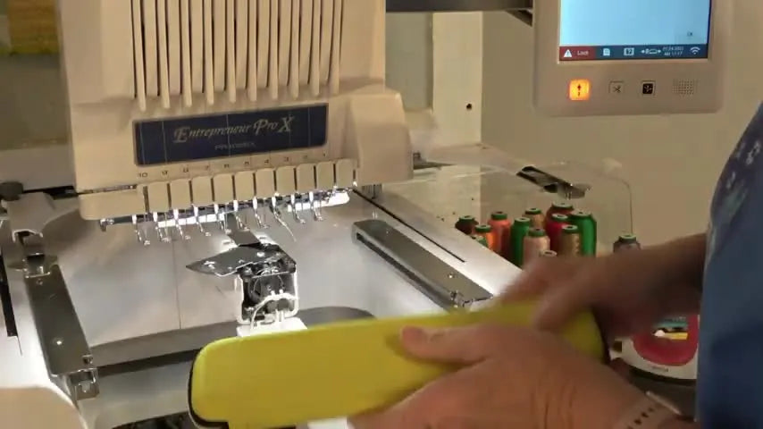 An extreme close-up shows a thin hook tool sliding between the Brother PR1055X trimmer blades to pull out compacted thread.