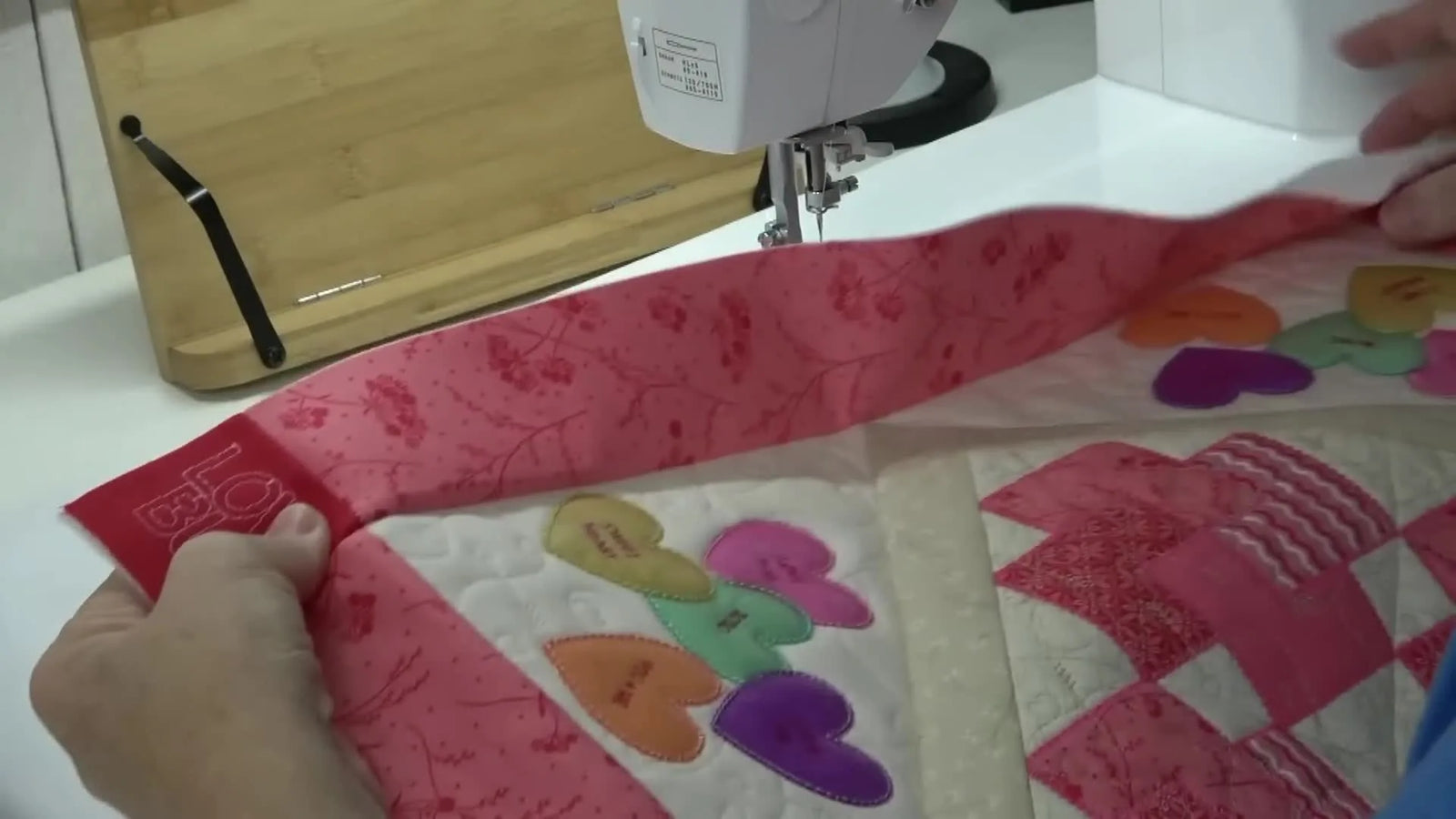 From Embroidered Blocks to a Flat, Square Love Bug Table Topper: Pin-Perfect Points, Clapper-Flat Seams, and a Machine Binding That Disappears