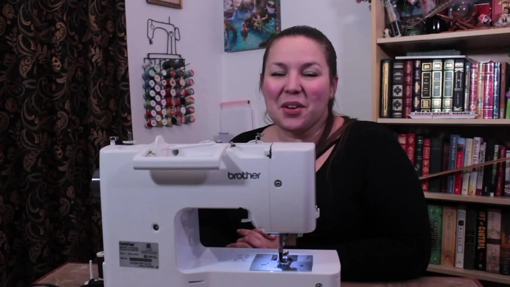 Woman smiling with a Brother ST371HD sewing machine in front of her, title 'Machine Threading' on screen.