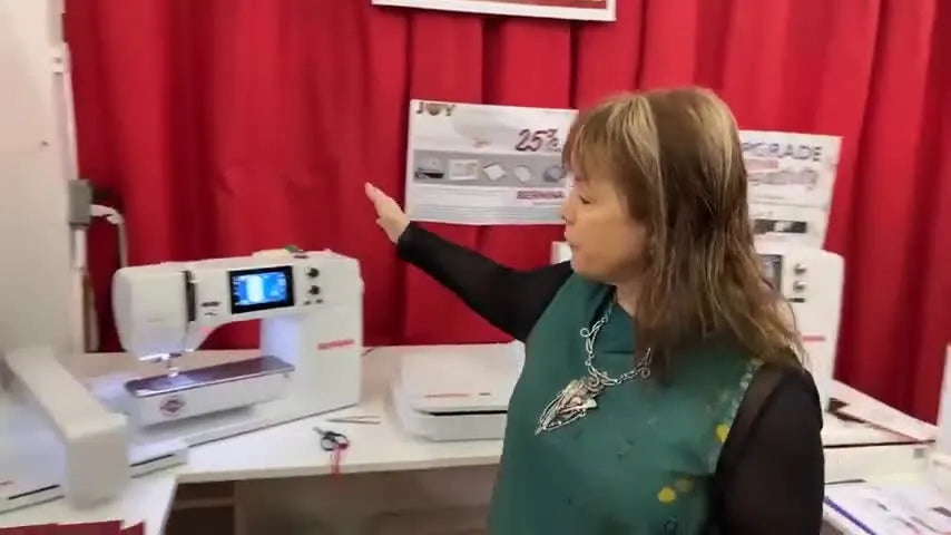 A side-by-side view comparing the compact Bernina B 500 embroidery-only machine with a larger Bernina 7 Series machine on a shop table.