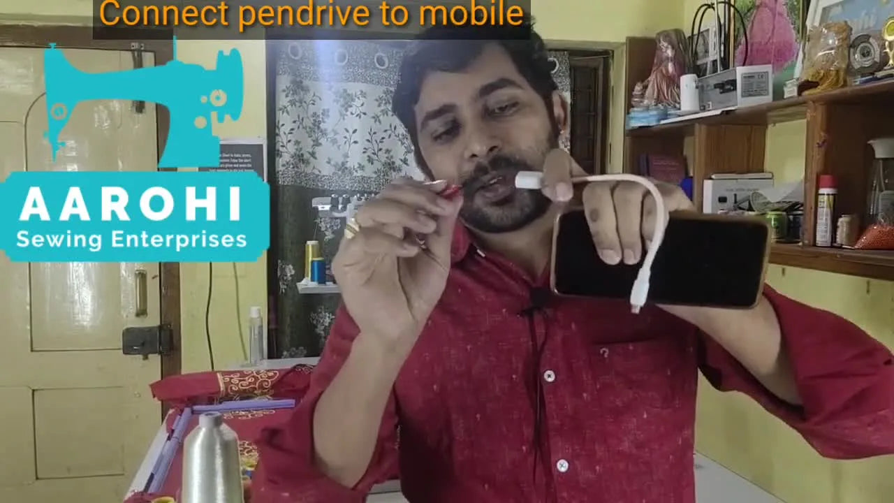 A close-up shows an Android phone connected to a USB flash drive through a white OTG cable, ready for embroidery file transfer.