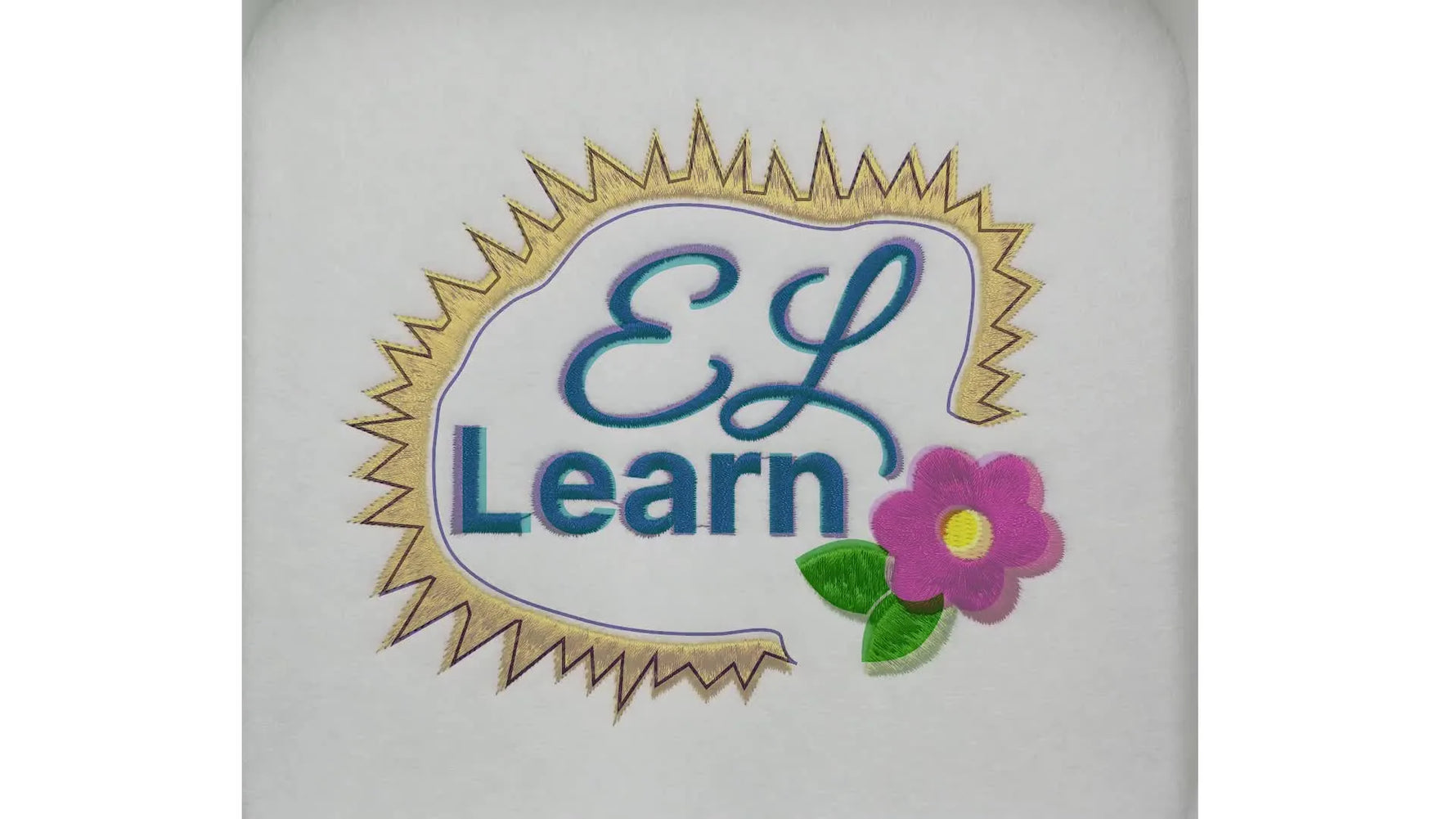 A close-up of the finished embroidered patch showing clean satin lettering and a flower, demonstrating a production-friendly sew-out.