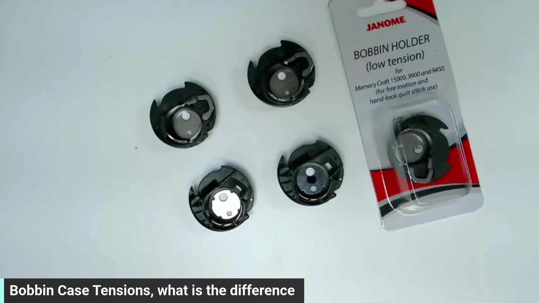 Multiple bobbin cases with color dots and labels indicating preset tensions.