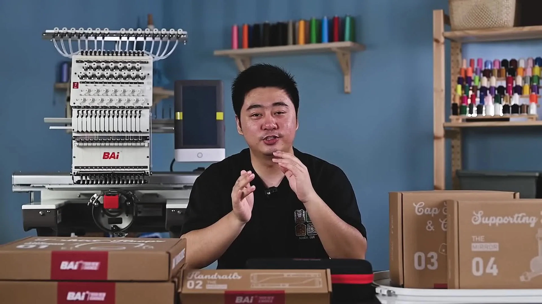 Man standing in front of an embroidery machine, surrounded by accessory boxes, with text overlay 'Free Accessories & How to Use Them'.