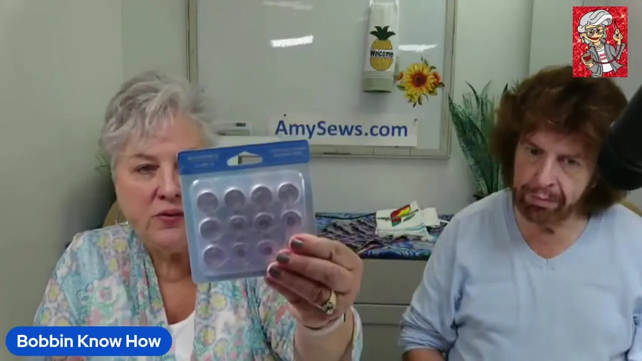 A close-up of Amy holding a retail pack of WonderFil pre-wound bobbins while explaining how to match bobbin thread to your machine.