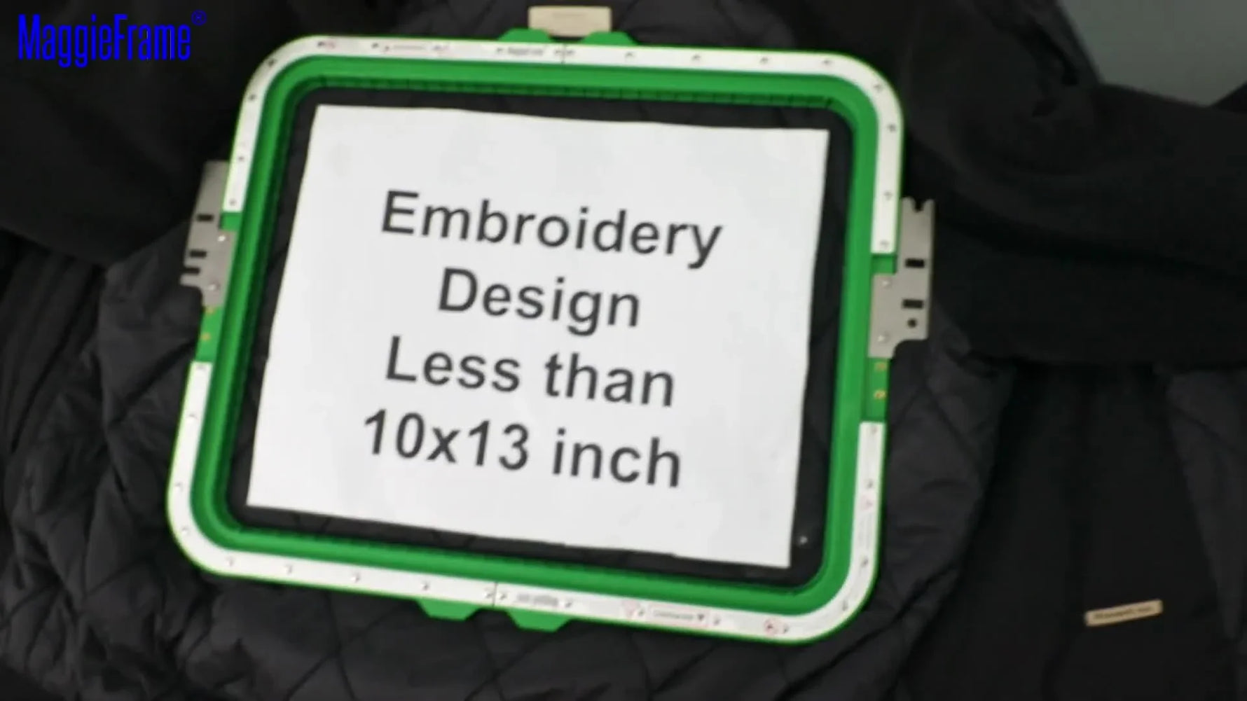 A thick quilted jacket is securely clamped as the upper magnetic frame snaps into place over the backing and garment layers.