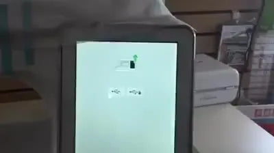 The Baby Lock Solaris screen shows the white update loader menu with USB icons, confirming the machine is in firmware update mode.