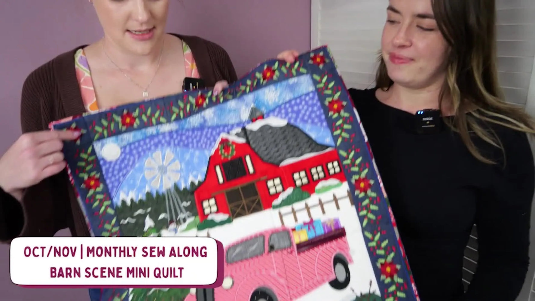 Cassie holds up the Winter Barn Scene Mini Quilt, showing the full scene layout and scale at a glance.