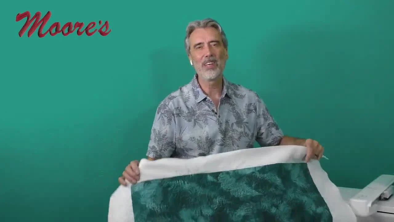 George holds the 10x10 magnetic frame used for Edge-to-Edge Quilting on the Baby Lock Solaris Vision.