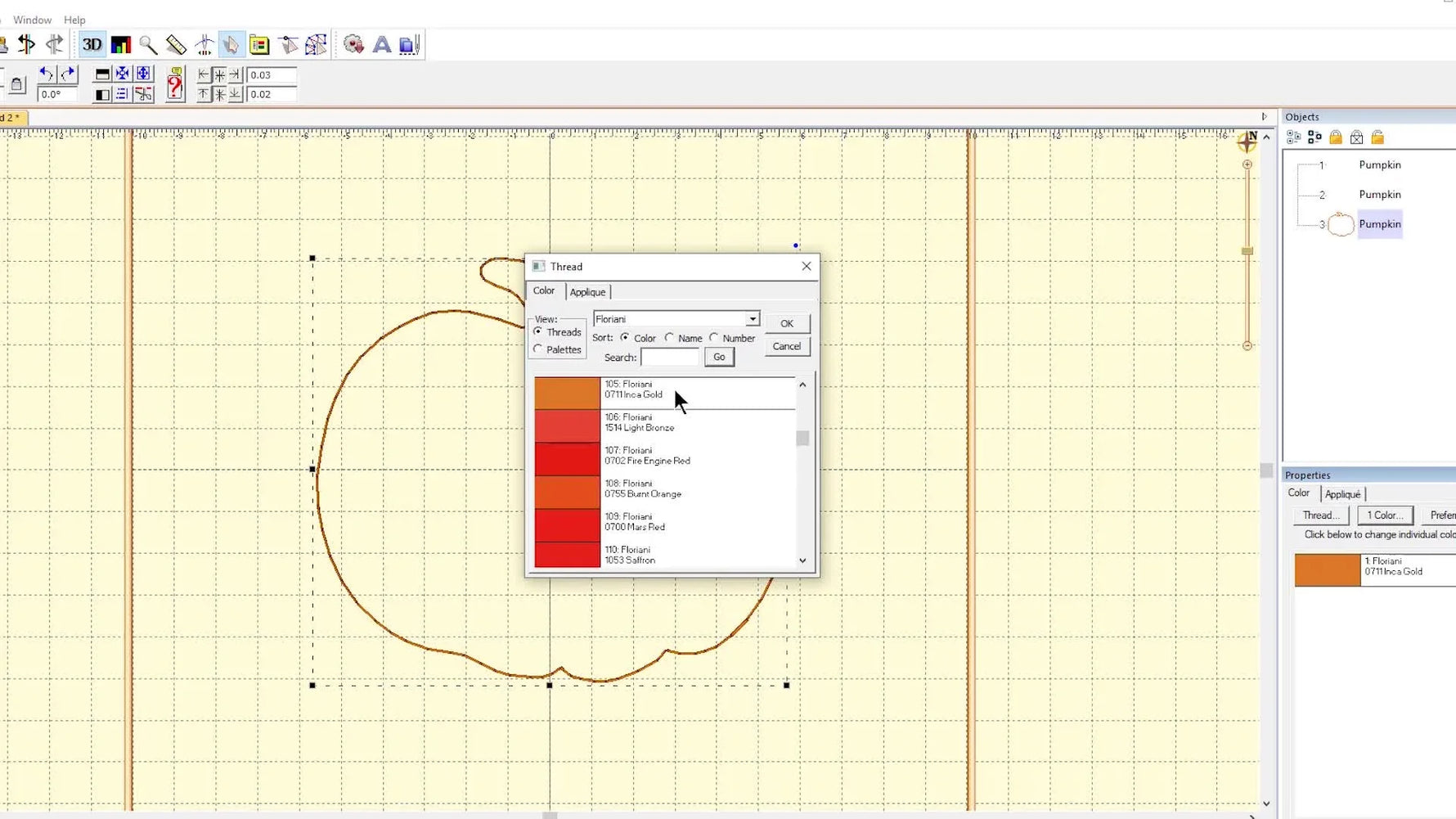 Embrilliance shows a pumpkin appliqué shape filled with a simulated orange fabric preview, making placement and color decisions easier before stitching.