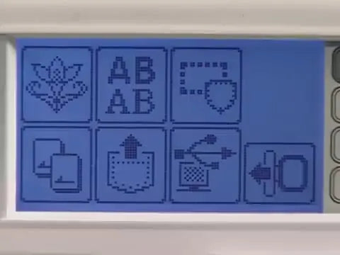 A stylus points to the Computer/USB icon on a Brother embroidery machine LCD, showing the exact menu entry used to retrieve designs from a connected computer.