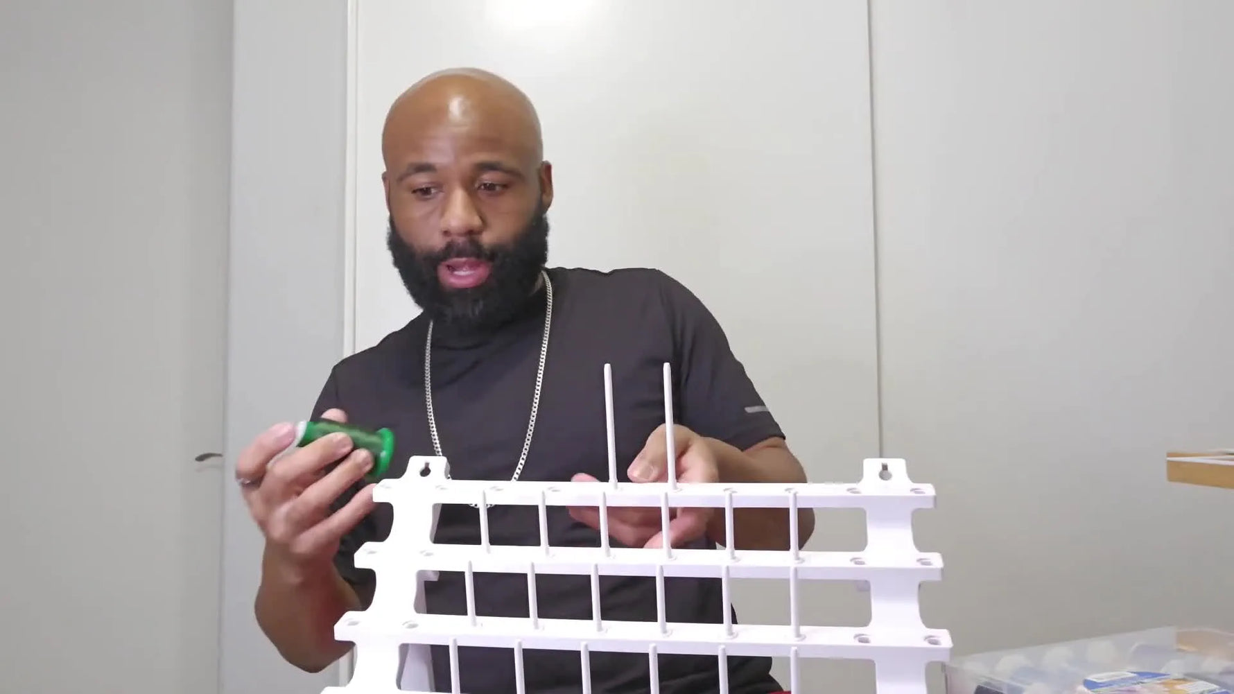 A fully assembled Sew Tech adjustable thread rack loaded with colorful spools, showing the final organized setup.