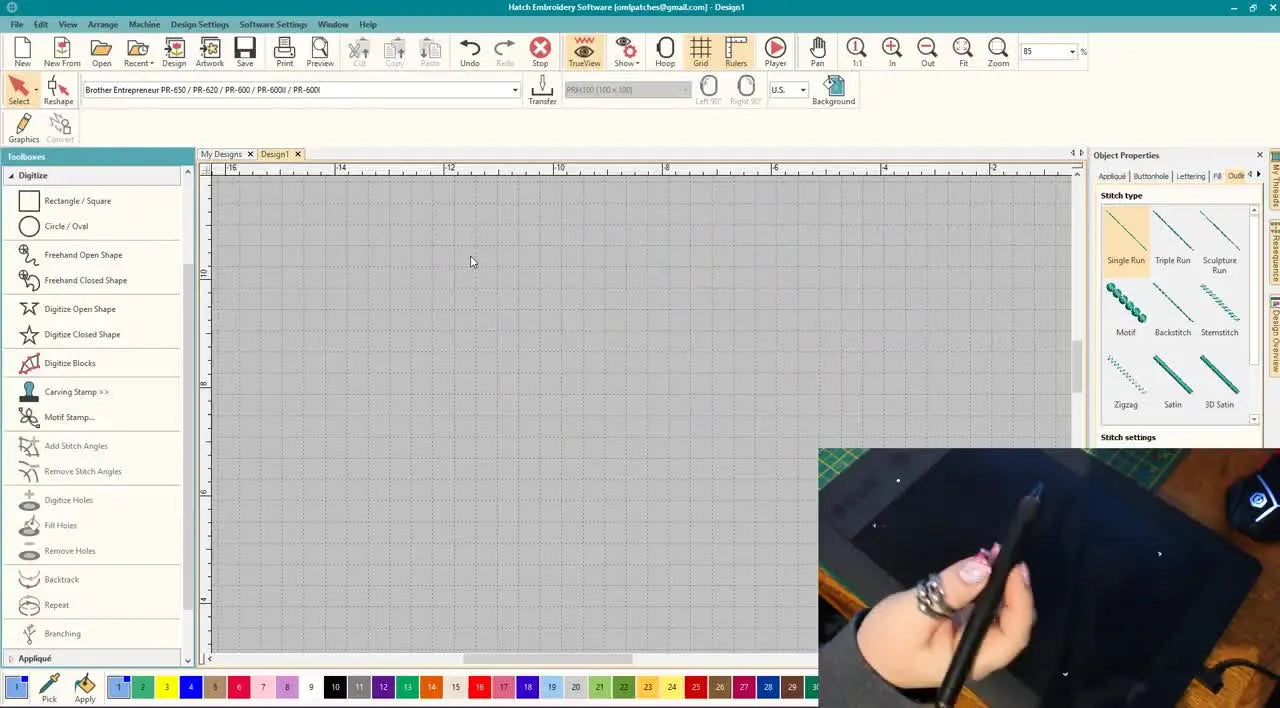 A close-up shows the correct ergonomic stylus grip with the index finger resting naturally over the pen’s rocker buttons for confident digitizing in Hatch.