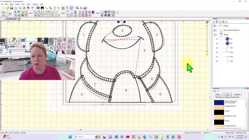 A finished, fully digitized snowman Snapplique design sits perfectly aligned on the software grid, ready for a clean stitch-out.
