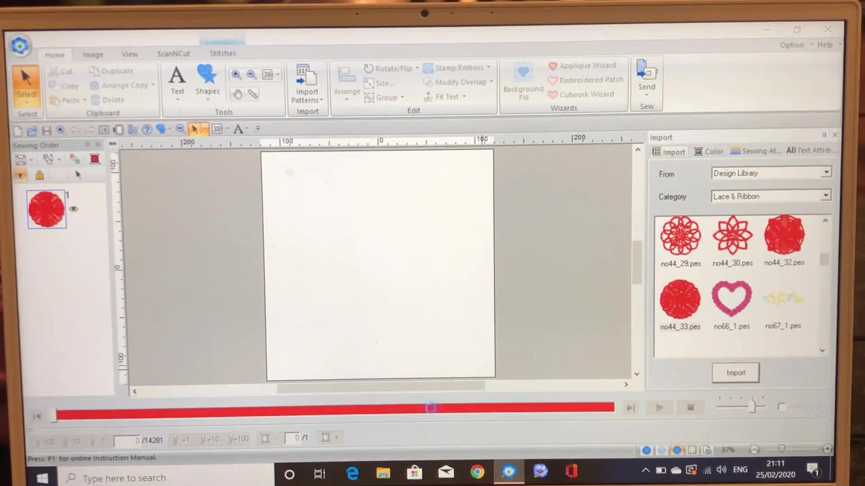 A red lace circular design has been imported into PE Design 11 and sits on the canvas, ready for text and additional elements.