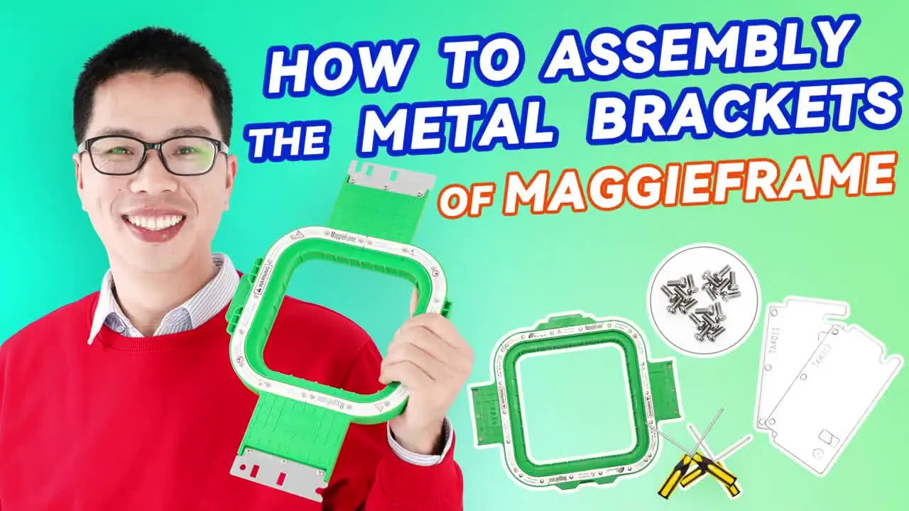 Jason holds a packaged MaggieFrame hoop in front of a wall of different hoop sizes, setting up the bracket-assembly demo.