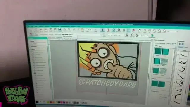 A finished black hoodie featuring a large Zenitsu embroidery with appliqué base layers and clean satin details.