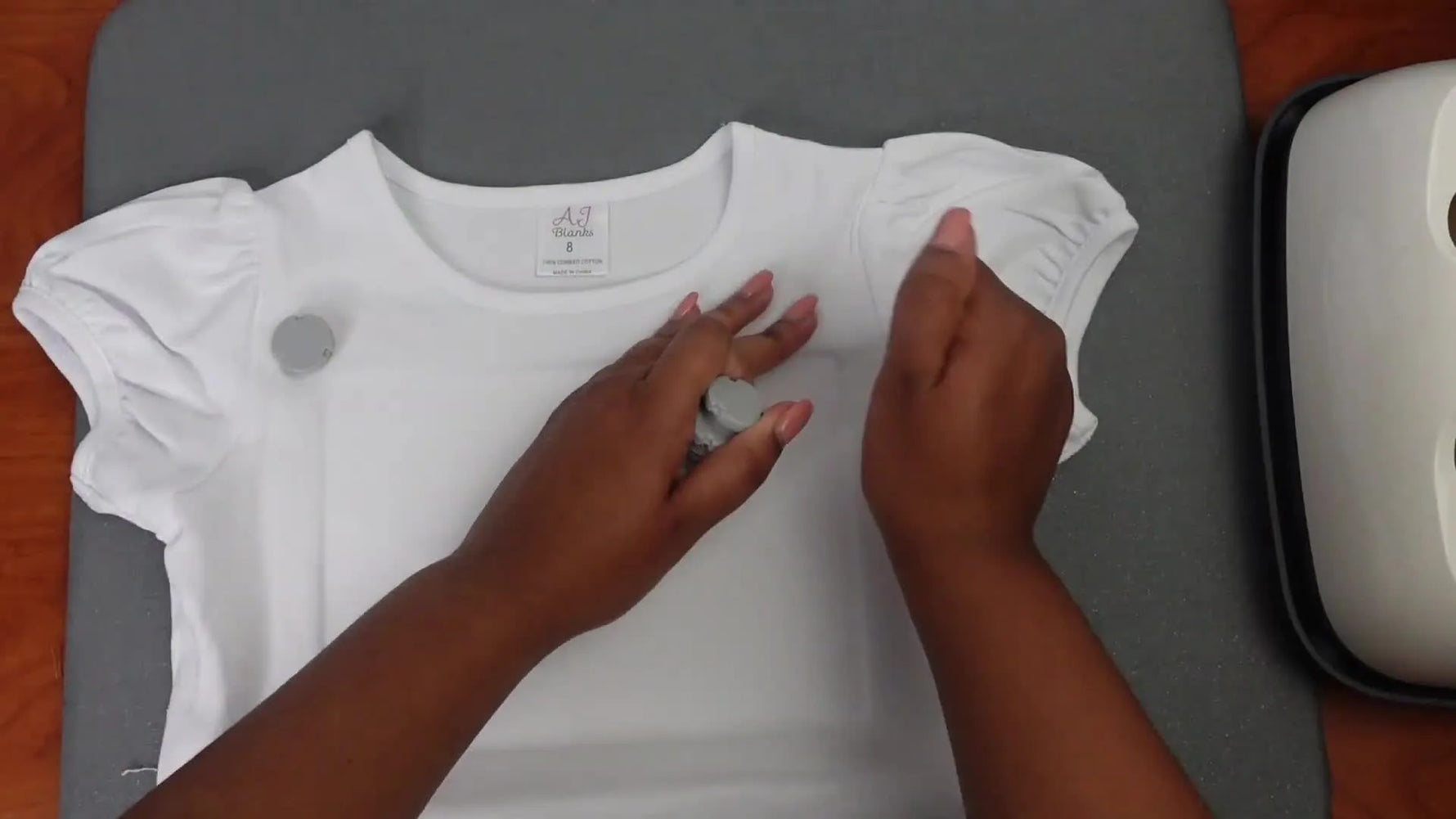 Magnetic hoop securing a t-shirt with multiple magnets.