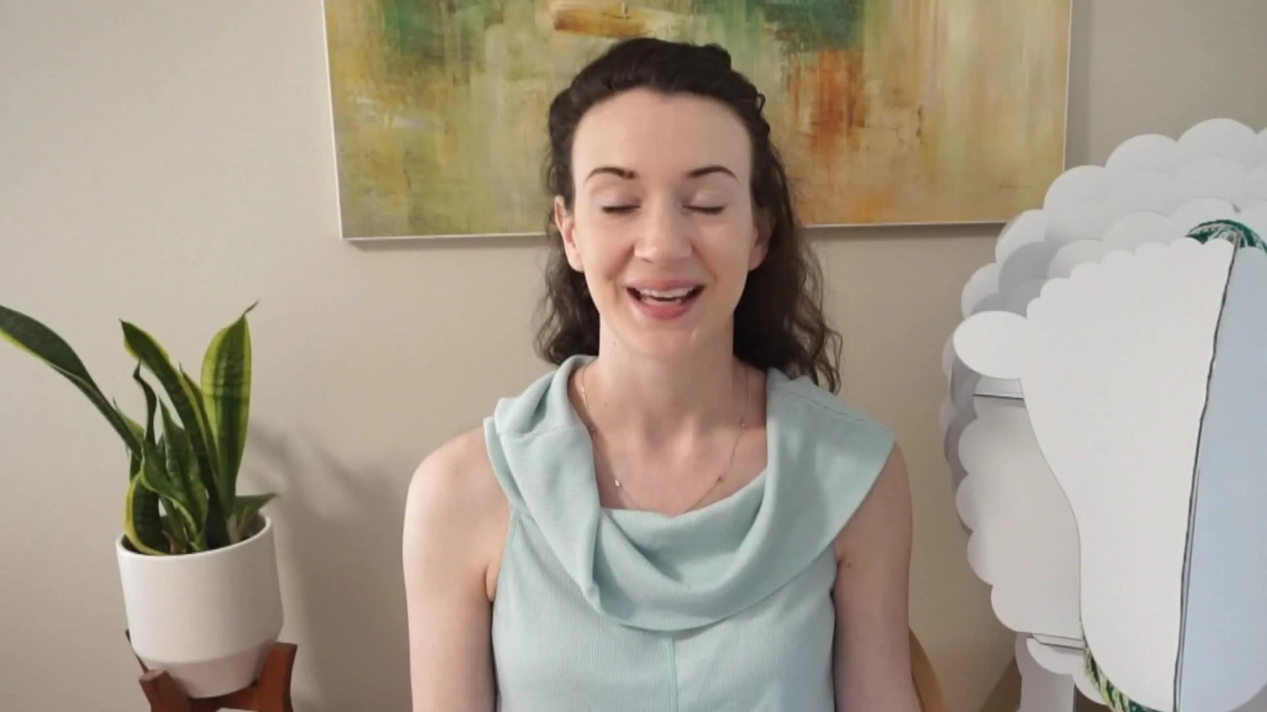 A woman speaking directly to the camera, introducing the video's topic.